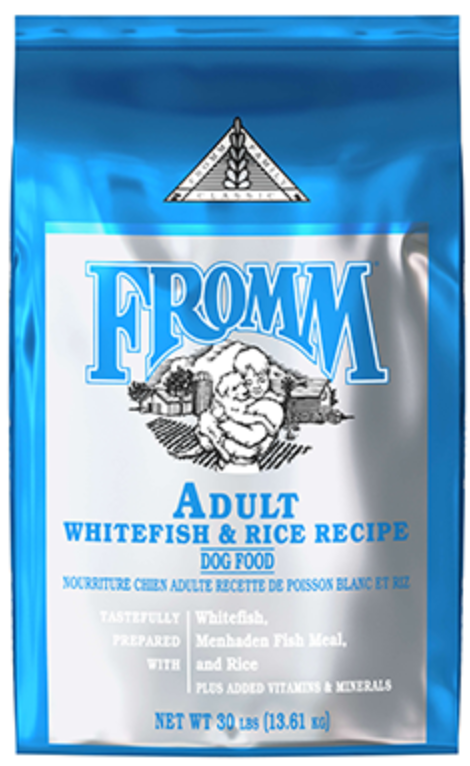 A 30 pound bag of Fromm Adult Whitefish & Rice Recipe dog food, featuring a metallic blue and silver package with a white label and blue text.